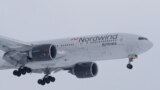 RUSSIA -- A Boeing 777 plane owned by Russia's Nordwind Airlines descends before landing and completing a direct flight from the Venezuelan capital of Caracas at Vnukovo International Airport outside Moscow, January 31, 2019